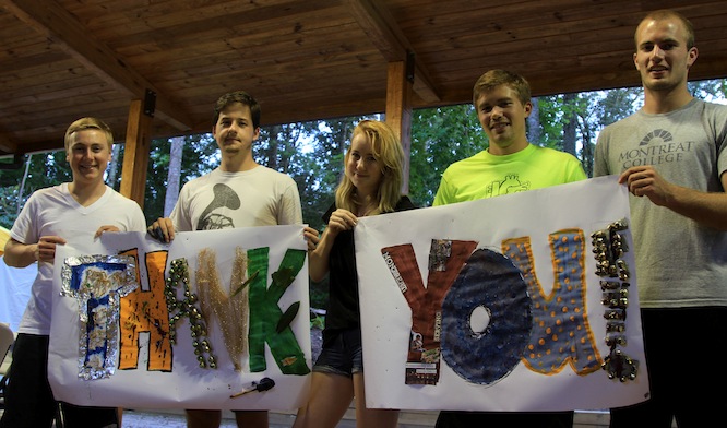 Wilson Scholars holding "Thank You" banners