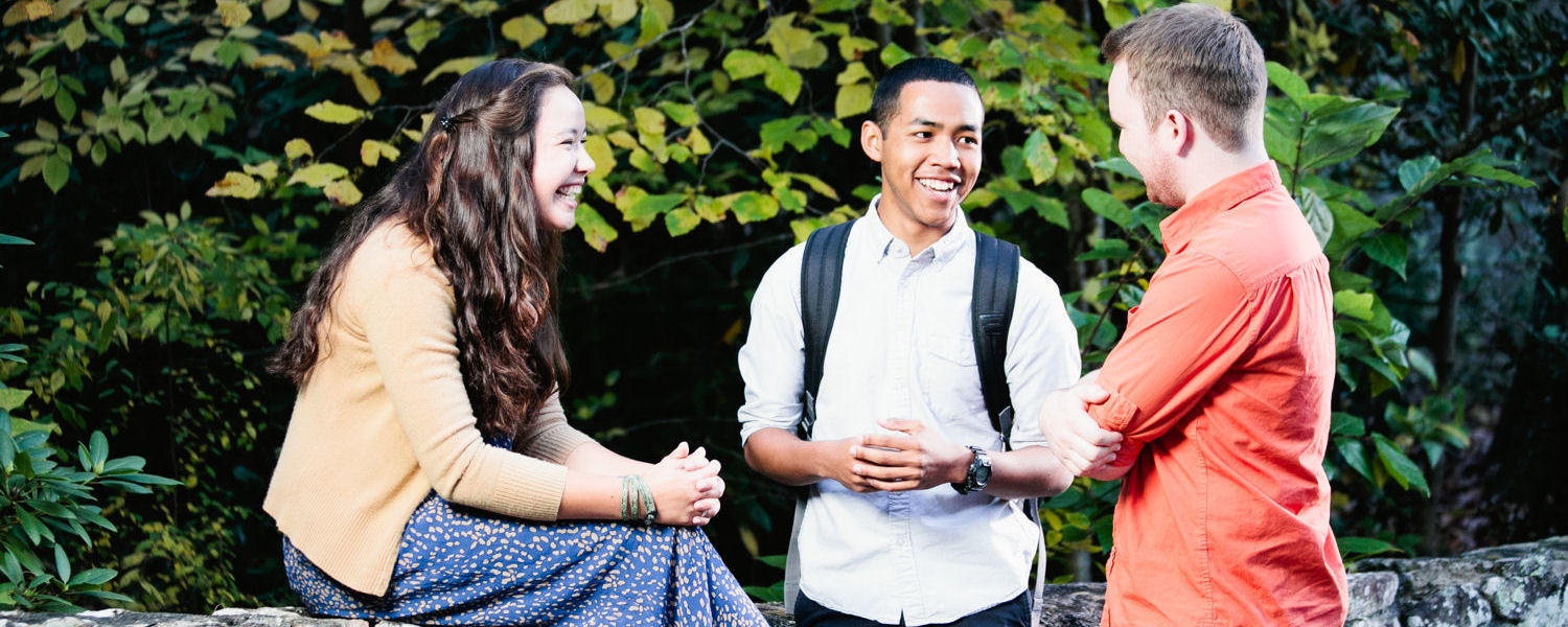 Three students talking Three students talking