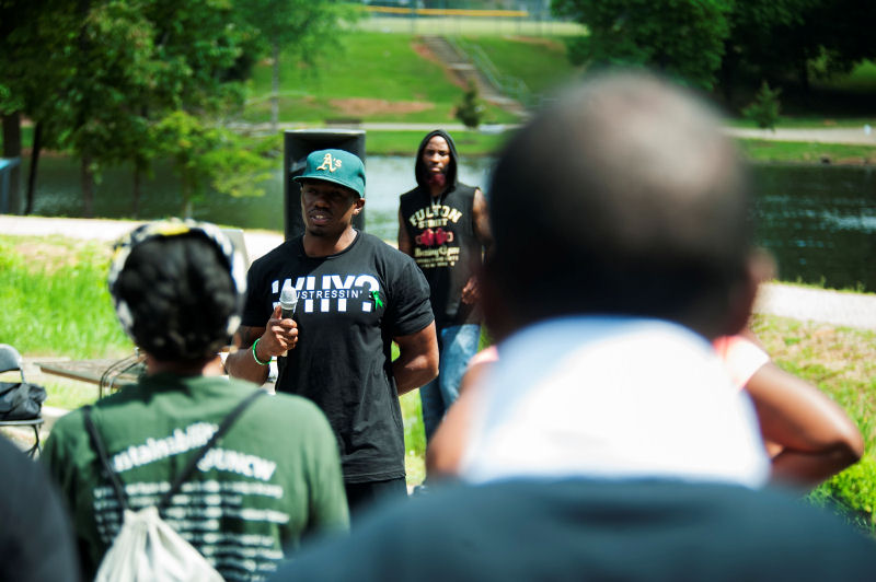 Rwenshaun Miller speaks at his annual "Let's Talk About It" mental health awareness walk