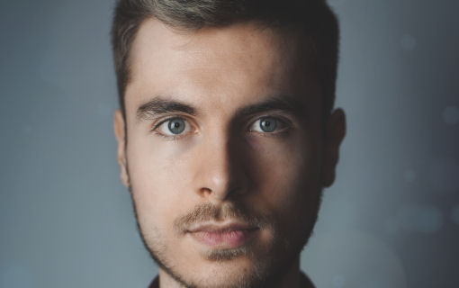 Thumbnail image of young man gazing intently at camera
