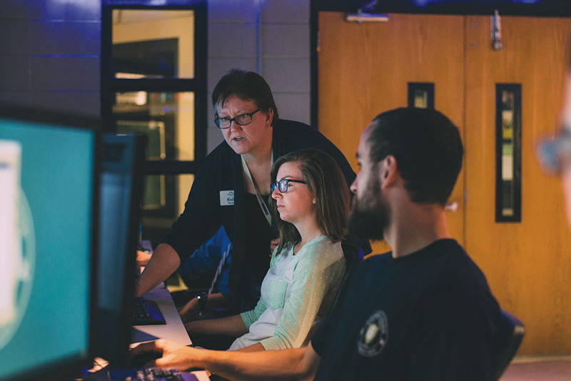 Montreat College cybersecurity students with cybersecurity professor Kelli Burgin