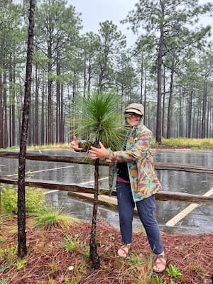 Dottie Shuman hugging a tree