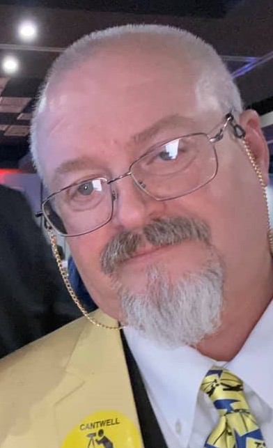 Gregg Cantwell wearing glasses with a chain