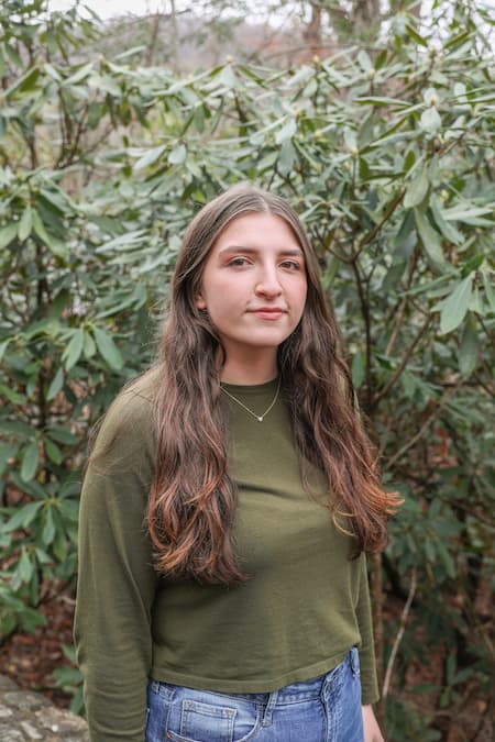 Lacie-Lee Parris standing outside in front of shrubbery