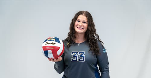 Kamryn Wolf holds a volleyball