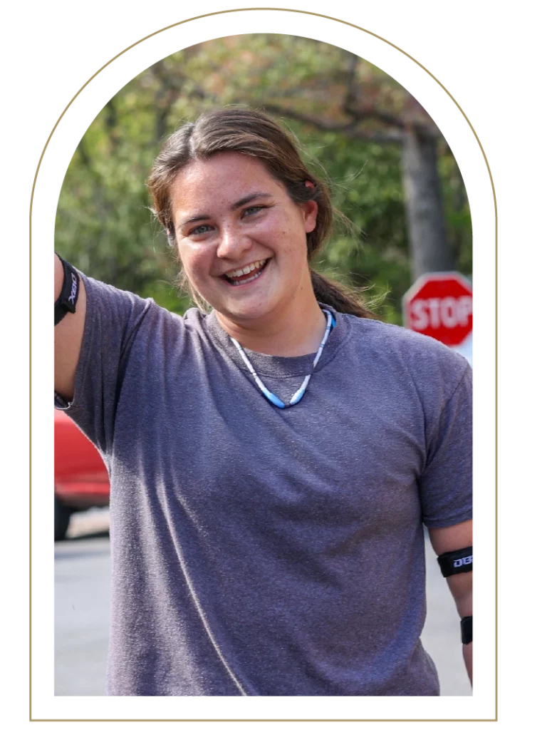 Portrait of a young woman in a bluish purple shirt