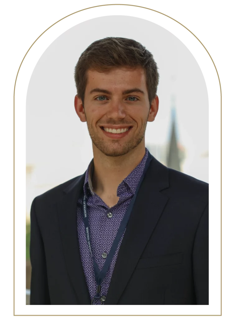 Photo of a young man wearing a suit jacket and dress shirt