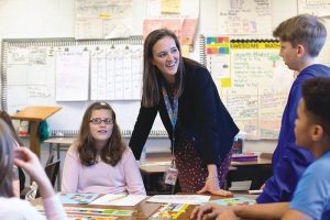 Caroline Clark teaches two boys and a girl