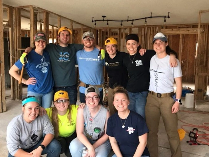 Montreat College students volunteering, renovating a house