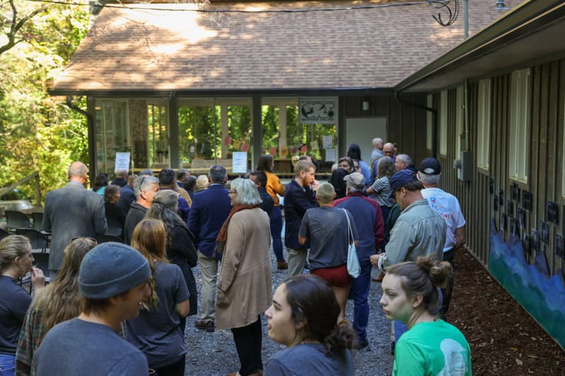 A crowd of people in front of Abbott Hall