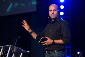 Skye Jethani speaking at a podium