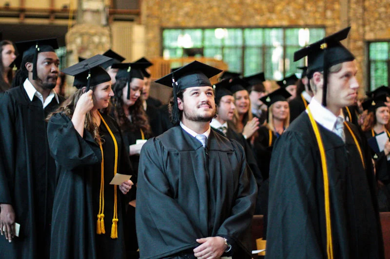 Students moving their tassels at a Montreat College commencement ceremony