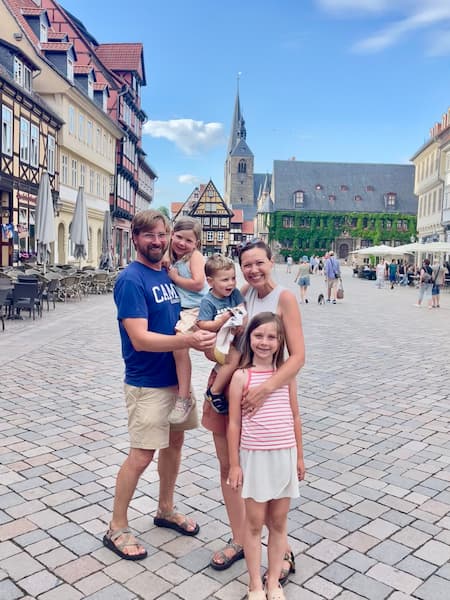 Peter Yoder and his family in front of a European old town square