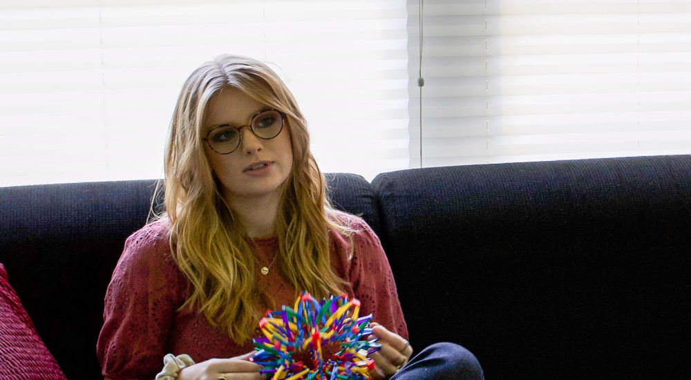 A young woman sitting on a couch