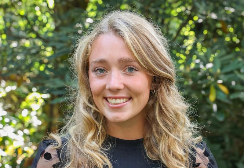 A young woman smiles