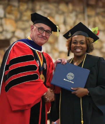 Photo of Paul Maurer with a graduate of Montreat College