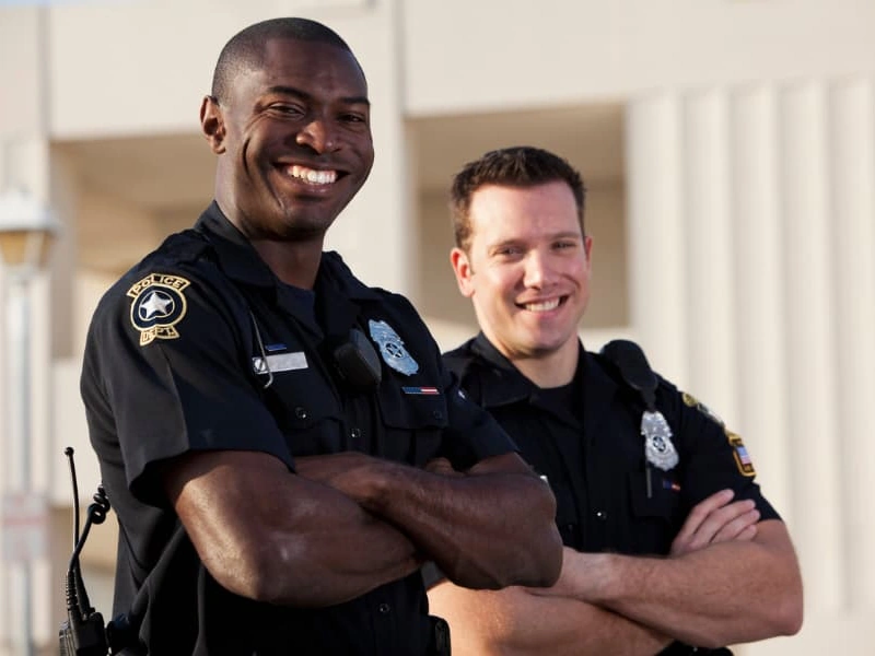 Two police officers smiling