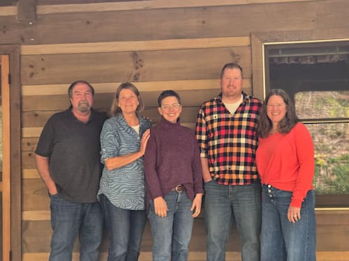 Rob and Natalie Schermerhorn (standing at the far left) with the rest of their family