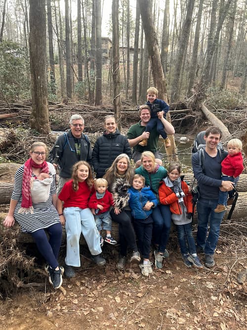 Rex and Tricia Hoffman and their extended family in the woods